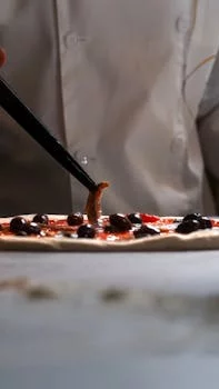 chef preparing fresh pizza dough